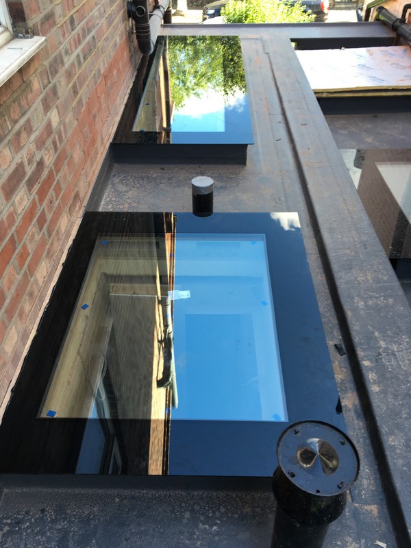 Multiple flat roof skylights on extension in Luton