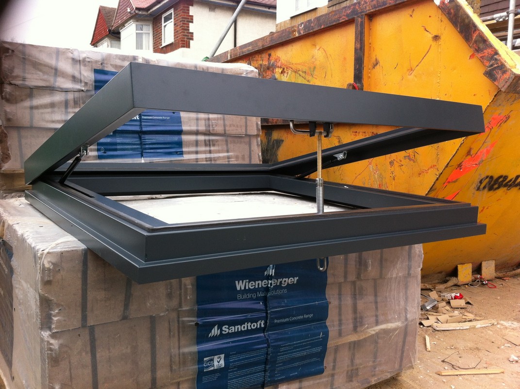 Opening flat roof skylight in anthracite grey installed in Luton